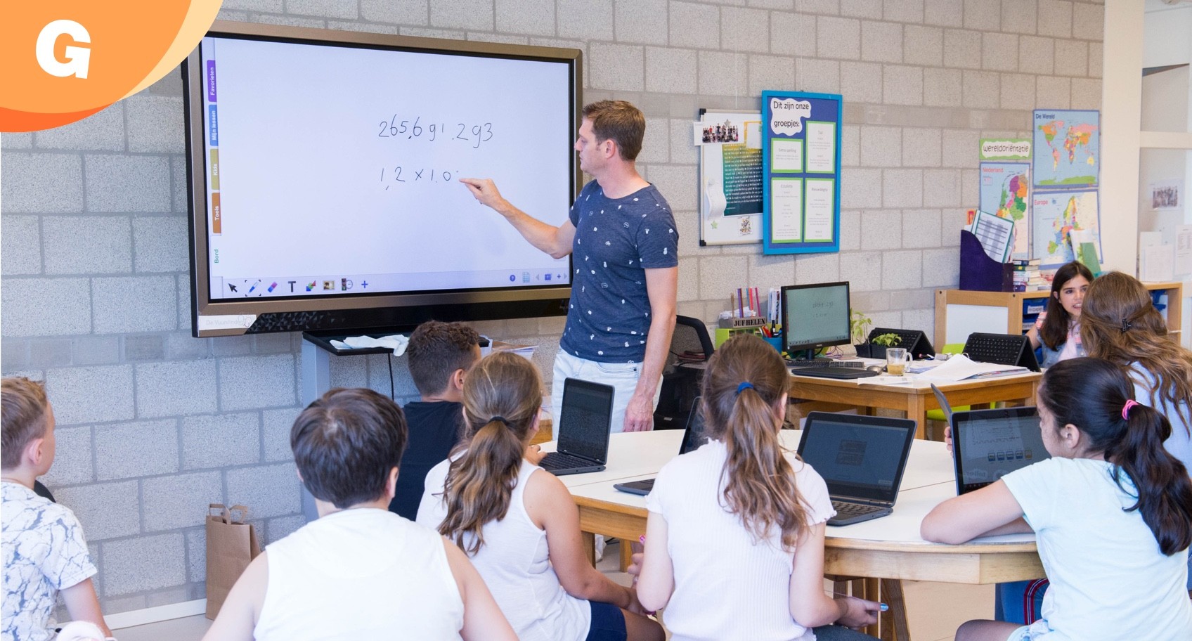 teacher writing on digital whiteboard teacher writing on digital whiteboard